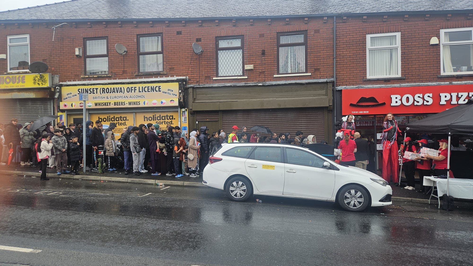 Hundreds Brave The Heavy Rain For Grand Opening Of Boss Pizza